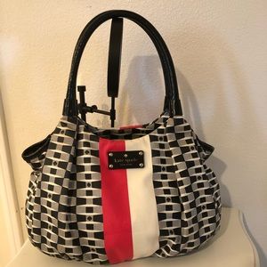 Kate Spade Hobo style bag- black/red/white in color, bottom feet- roomy satchel